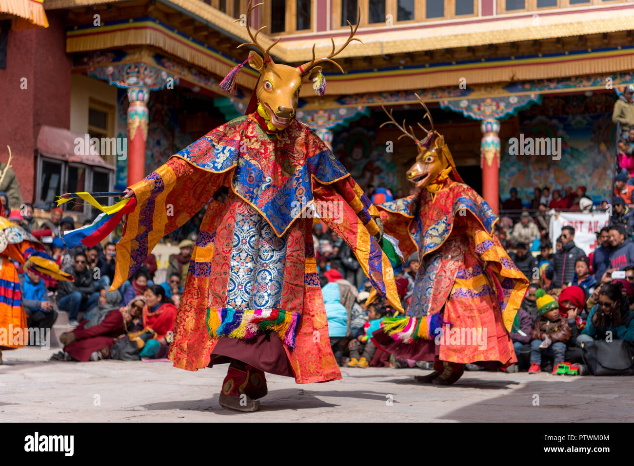 Dancing buddhist mask festival at Matho monastery in Ladakh, India. Monks performing dances to teach the people about buddhism and life Stock Photo
