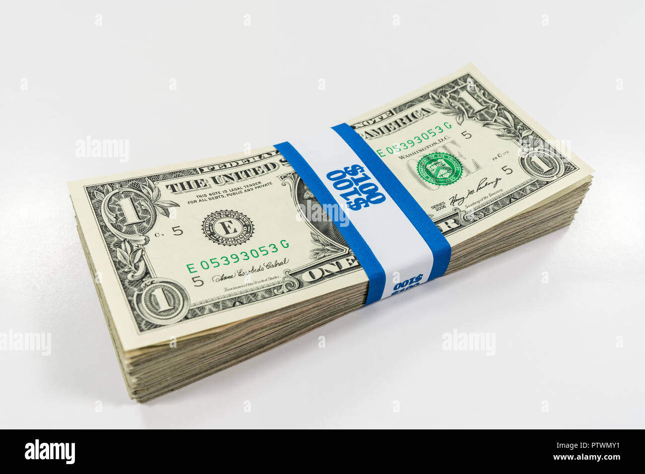 Pack of one dollar bills with $100 paper currency strap. Stock Photo