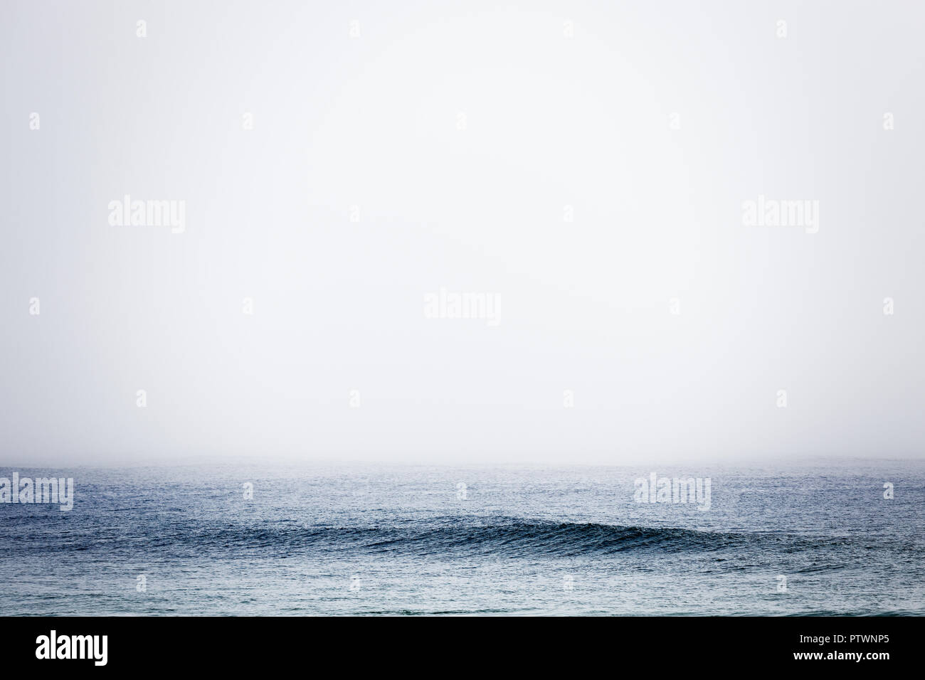 Minimalist foggy blue sea and sky Stock Photo