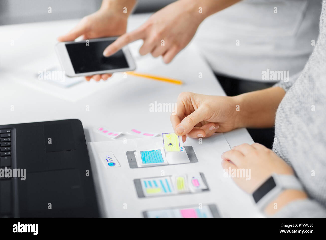 web designers creating mobile user interface Stock Photo