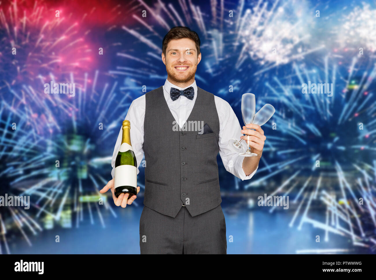 man with champagne at party over firework Stock Photo