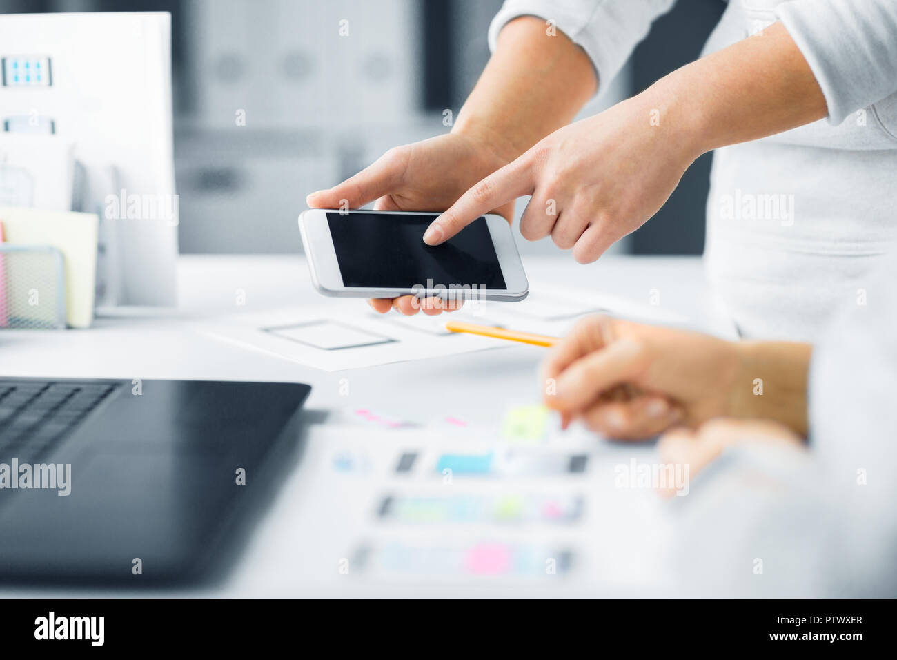web designers creating mobile user interface Stock Photo