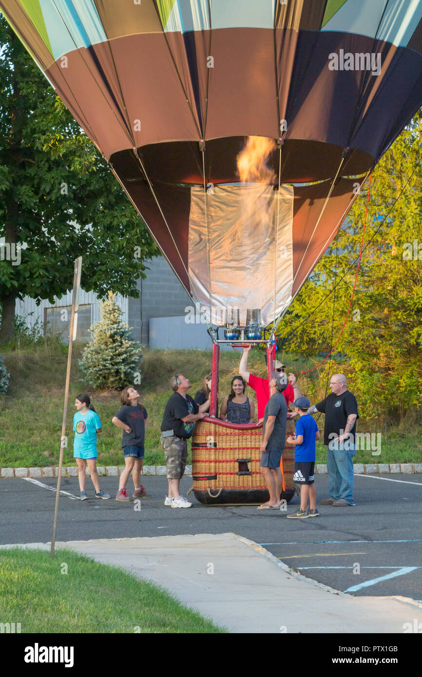 BRANCHBURG, NEW JERSEY July 28, 2018 People help a hot air balloon