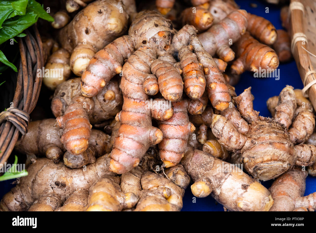 Tumeric root on display at the farmers market Stock Photo