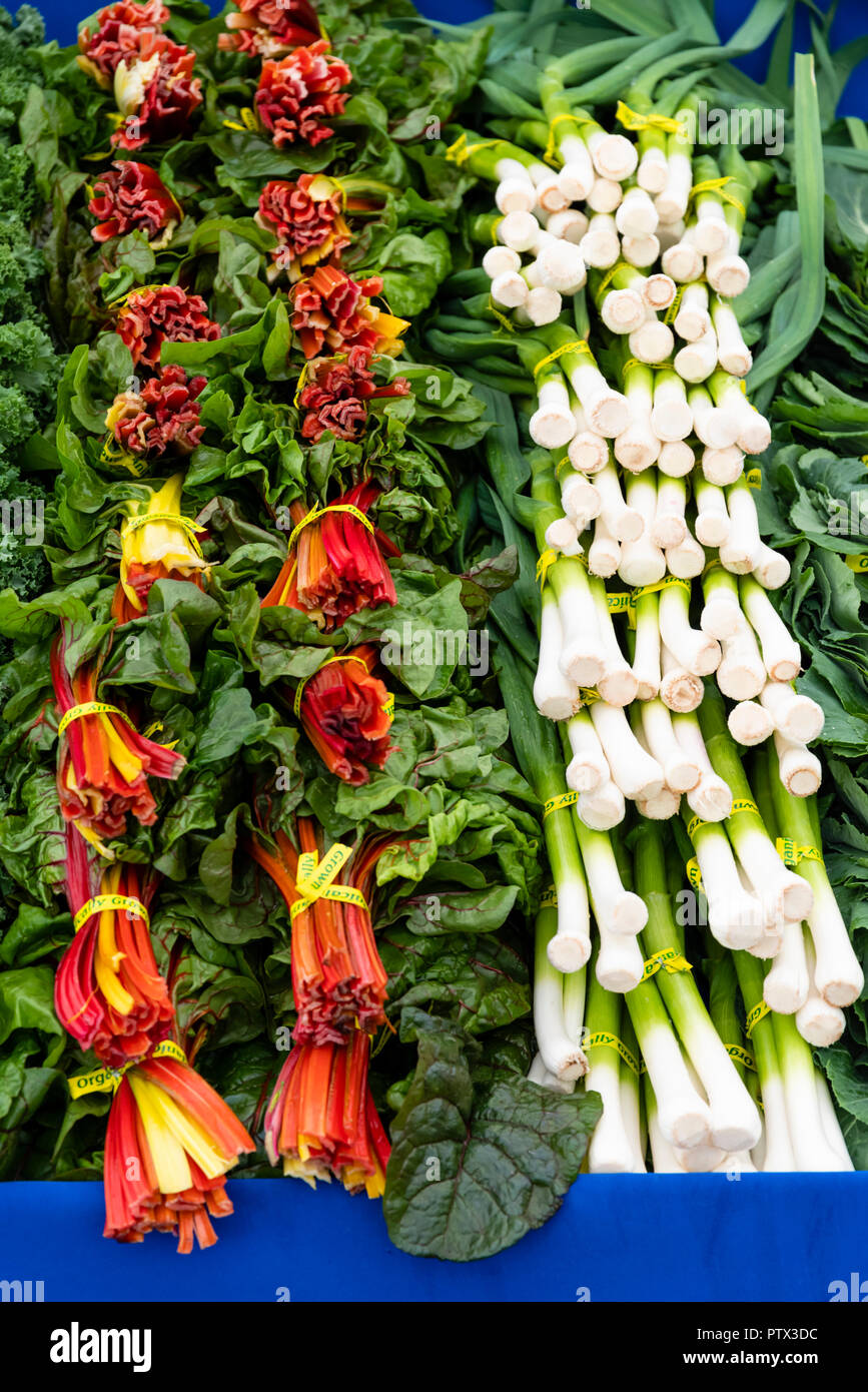 Swiss chard and leeks on display at the farmers market Stock Photo