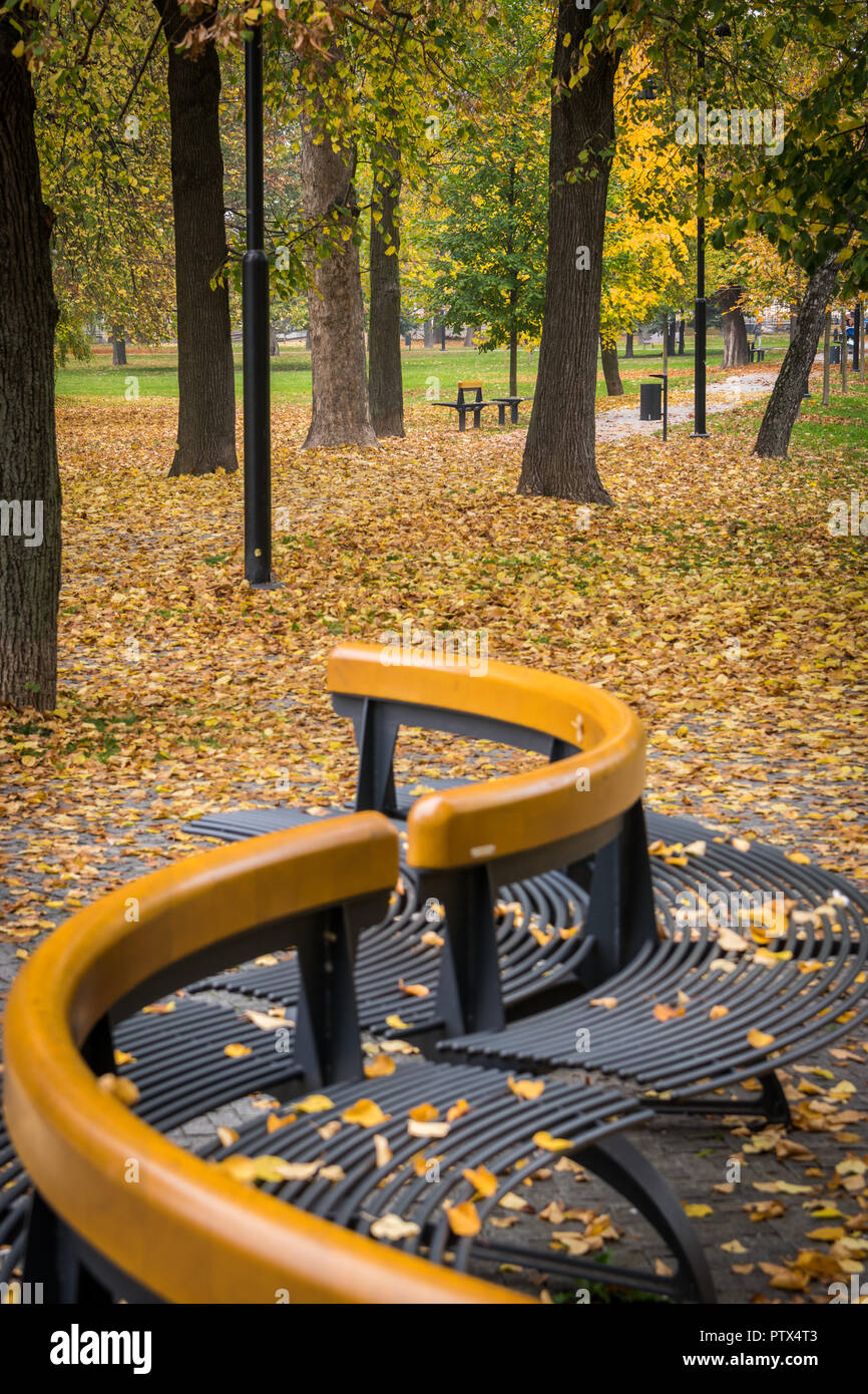 Park benches of Slovak park in Košice in the fall Stock Photo