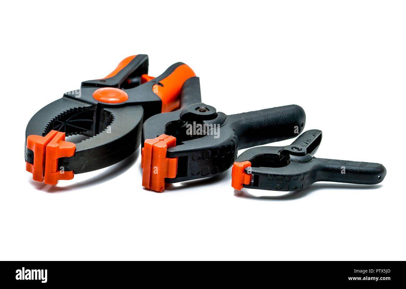 Black and orange spring clamp isolated on white background. Set of