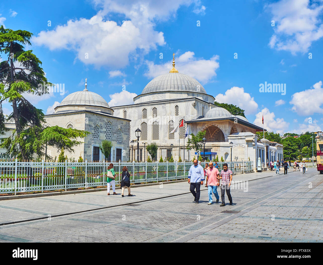 Istanbul, Turkey - July 8, 2018. Citizens walking in Sultanahmet Park, facing The Tomb of Sultan Ahmet I, on the north side of The Sultan Ahmet Mosque Stock Photo