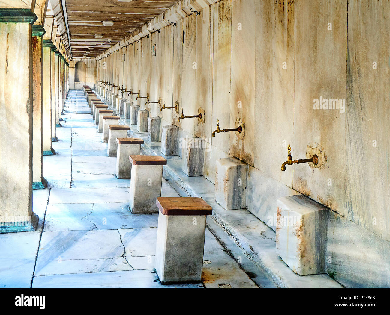 Ablution space of a mosque, Installations to provide to the Muslims space in a mosque for the cleansing process prior to prayer. Stock Photo