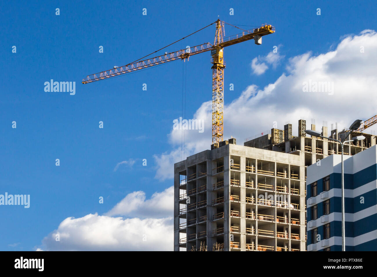 Construction crane on development site. No people. Stock Photo