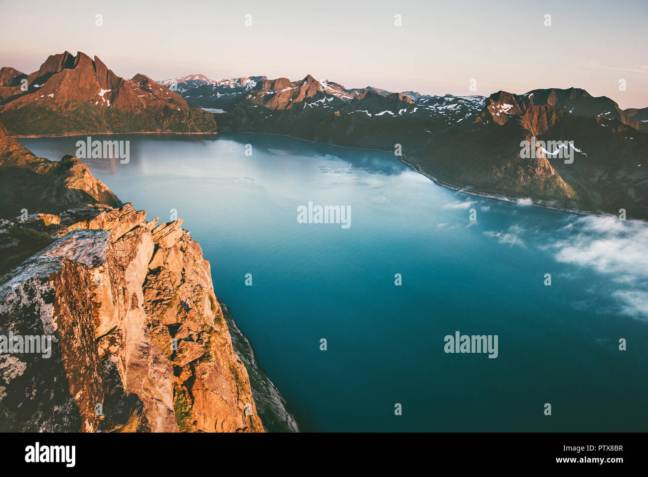 Landscape mountains and sea fjord sunset scenery in Norway aerial view Travel exploring Senja islands Stock Photo