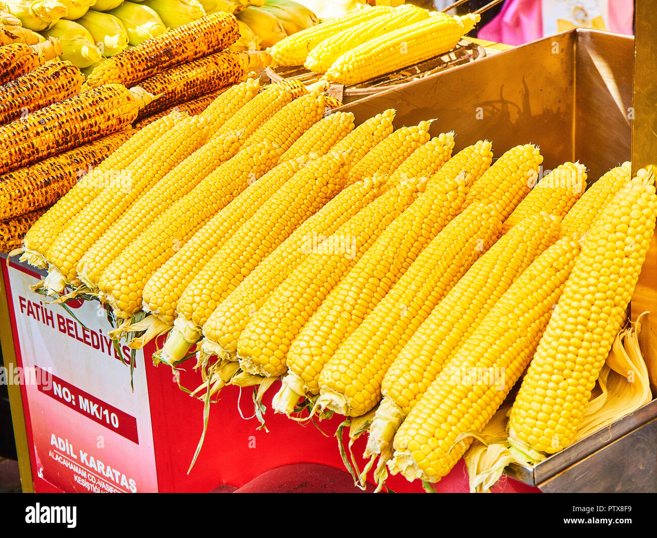 Istanbul, Turkey - July 11, 2018. A lot of raw corn cobs on a street stall of Eminonu, a former district of Istanbul, Turkey. Stock Photo