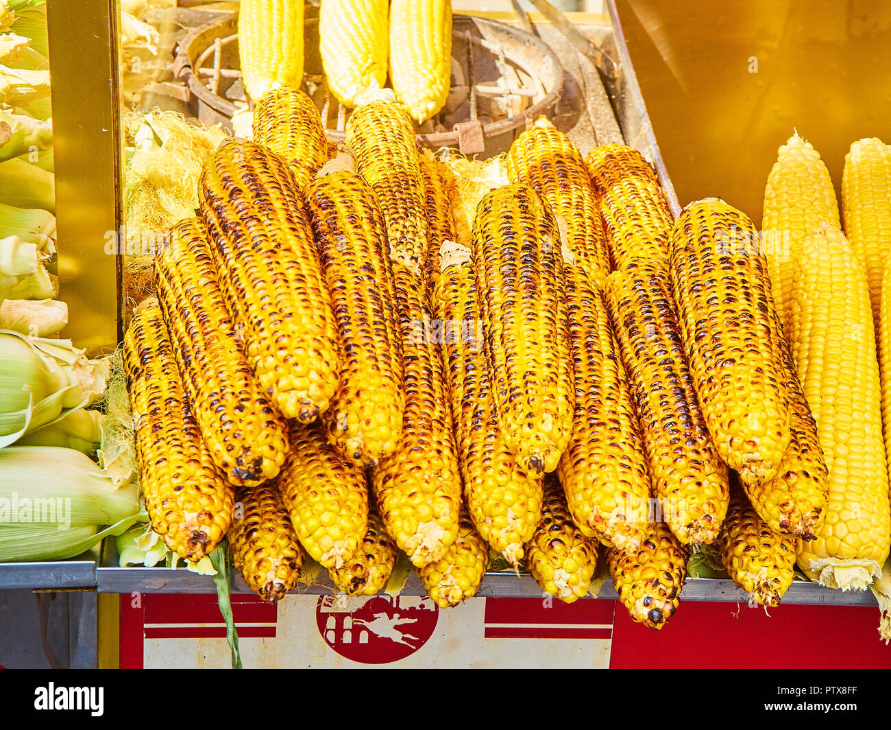 Istanbul, Turkey - July 11, 2018. A lot of grilled corn cobs on a street stall of Eminonu, a former district of Istanbul, Turkey. Stock Photo