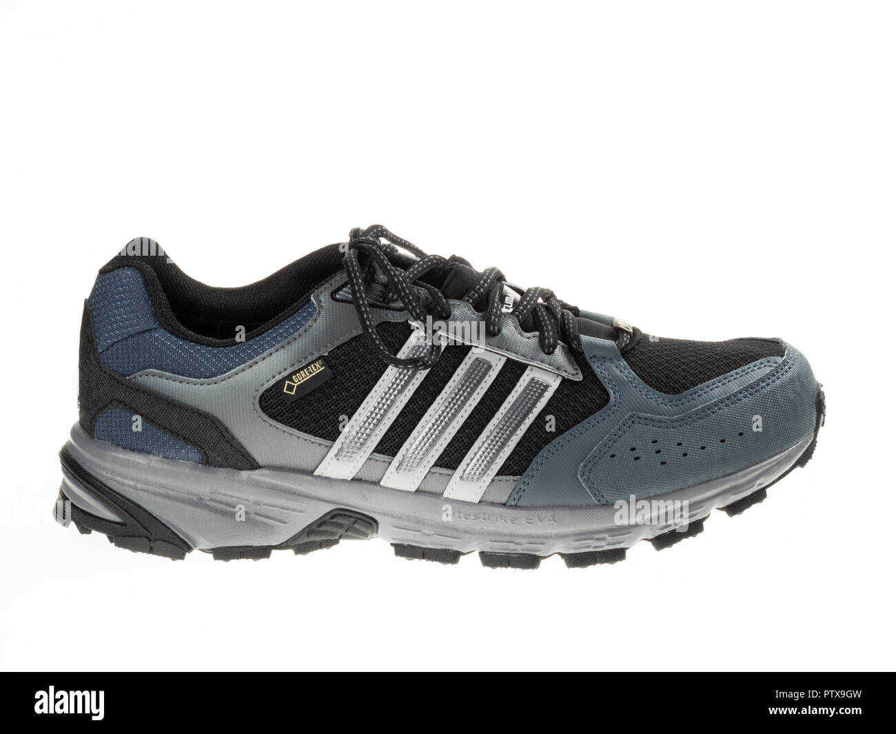 Istanbul, Turkey - January 29, 2014: New Adidas outdoor running shoes Taken at studio and isolated on white. Stock Photo