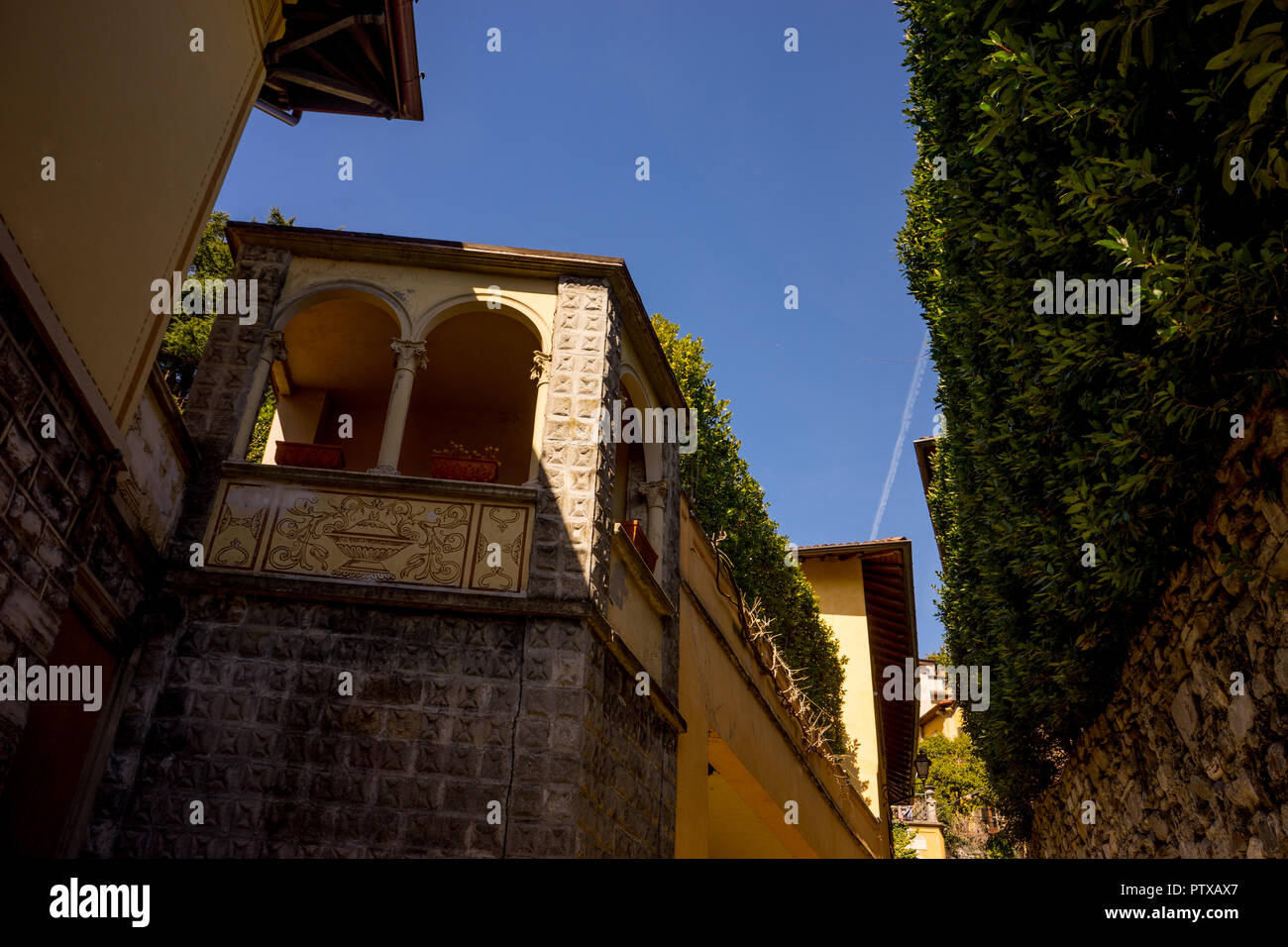 Menaggio, Italy-April 2, 2018: Arches on a tall building, Lombardy Stock Photo