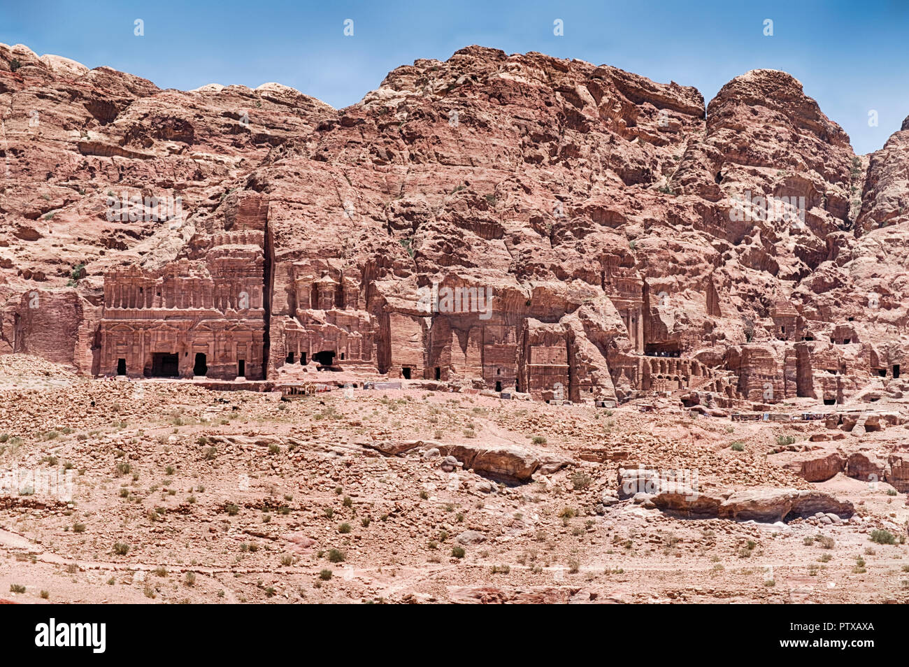 In this section of Petra, the Royal Tombs are a string of ornate burial chambers carved into the rocky cliffs. Stock Photo