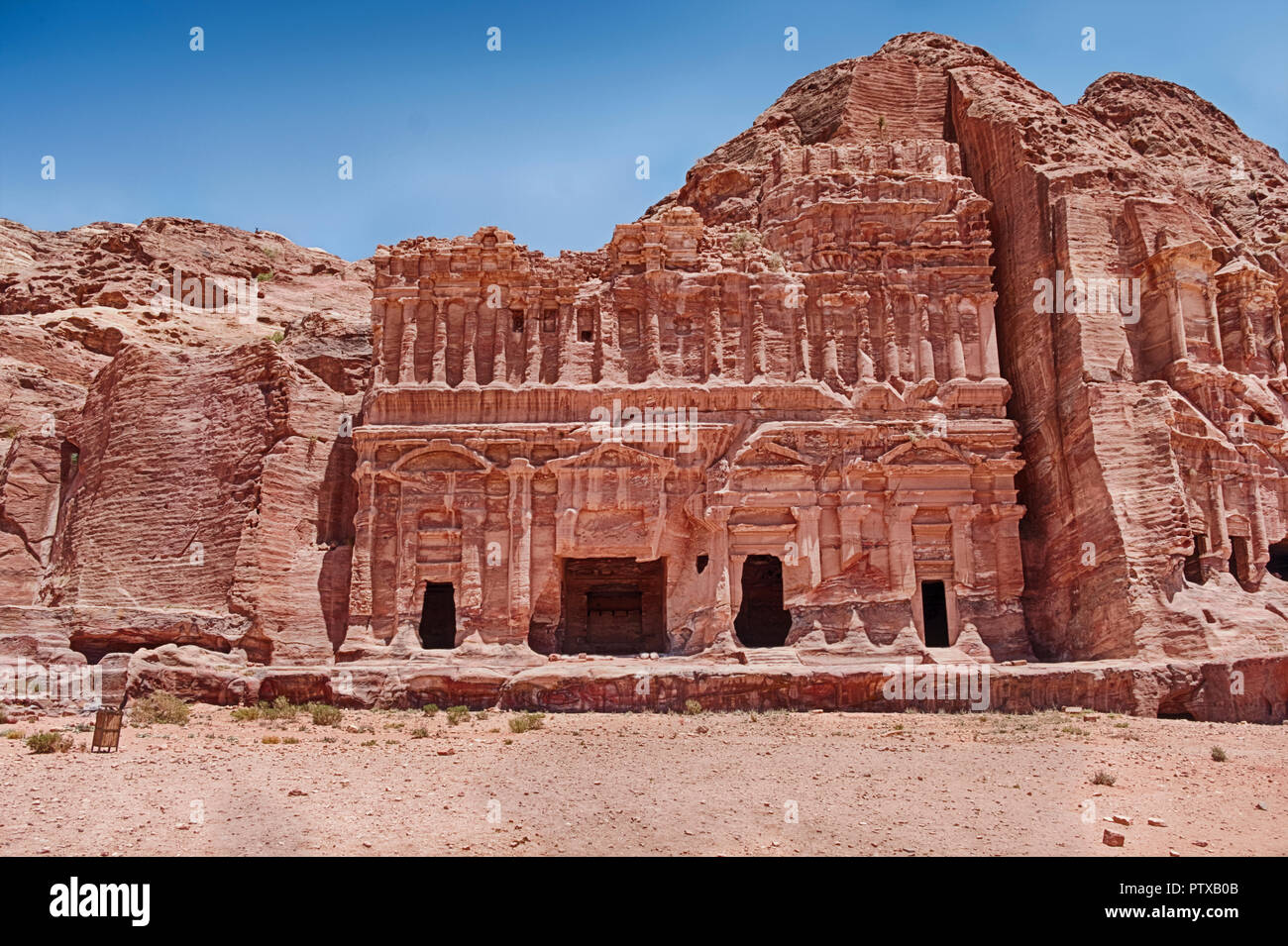 The ancient Palace Tomb of Petra in Jordan has a magnificant facade that has been carved into the sandstone cliffs. Stock Photo