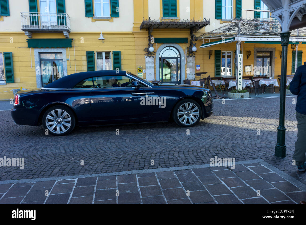 Menaggio, Italy-April 2, 2018: Rolls Royce Phantom waiting for a boat at waterside quay, Lombardy Stock Photo
