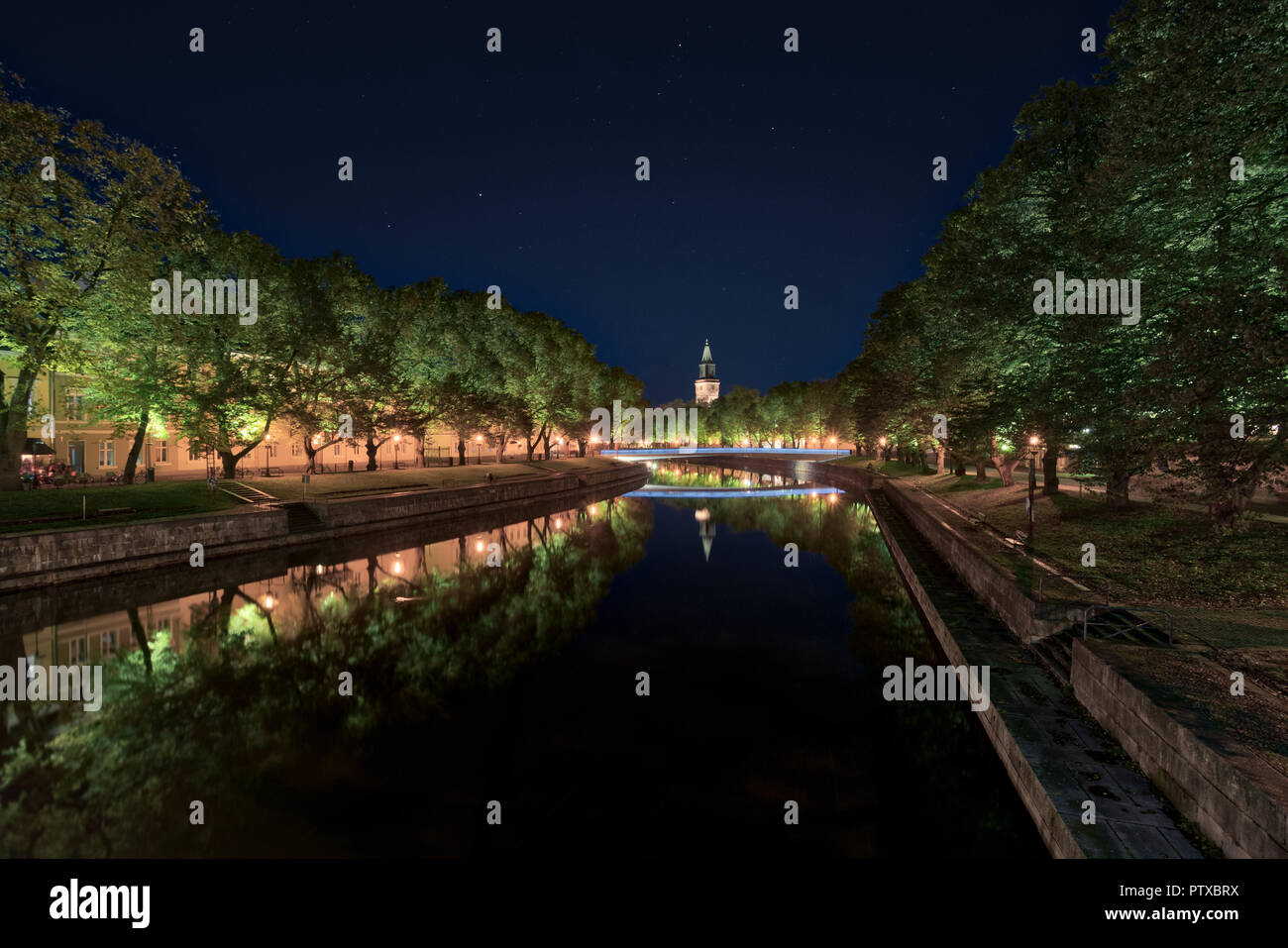 Aurajoki river at night with Turku Cathedral in the background Stock Photo