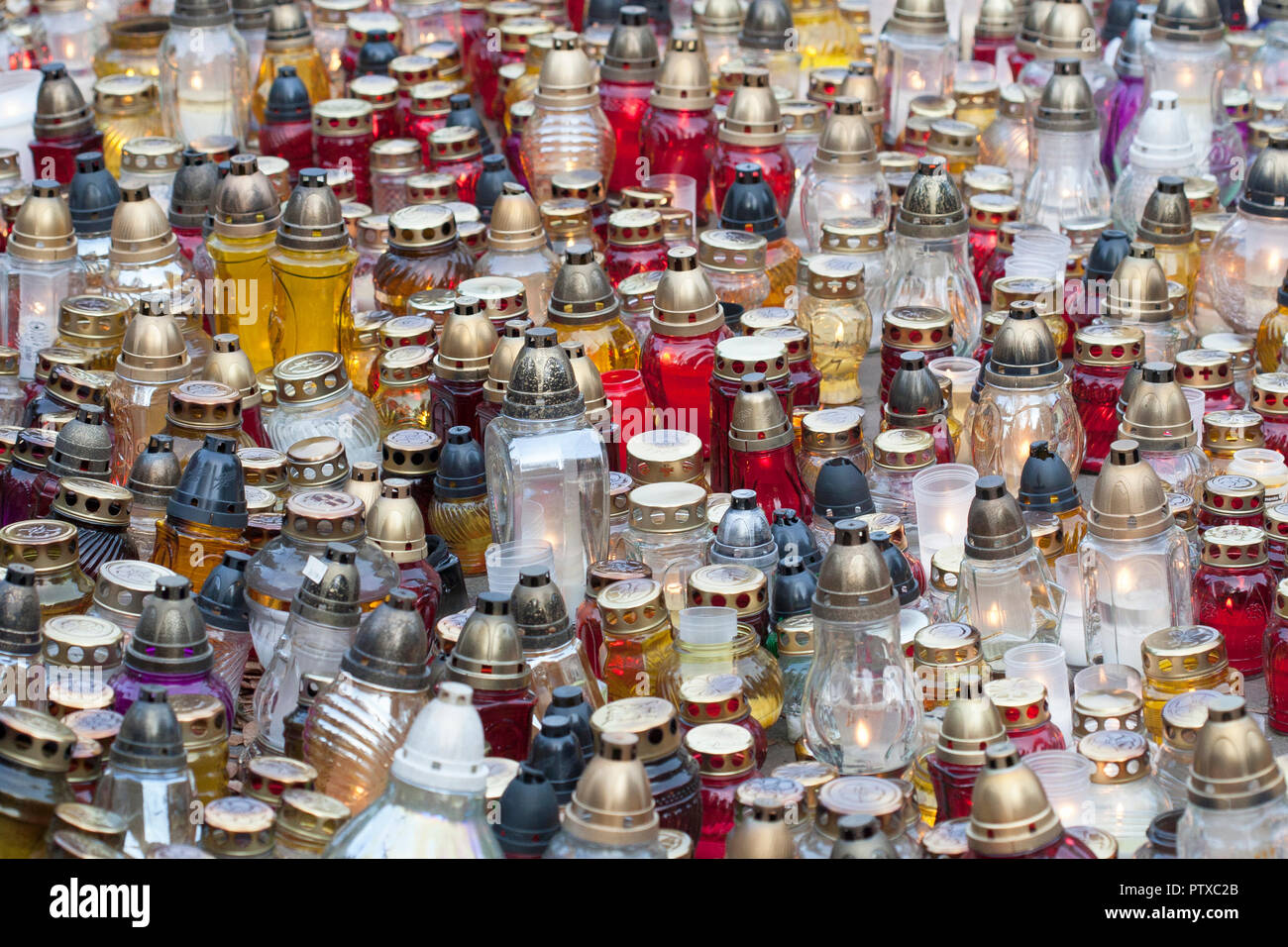 Large group of colorful burning votive candles, background Stock Photo