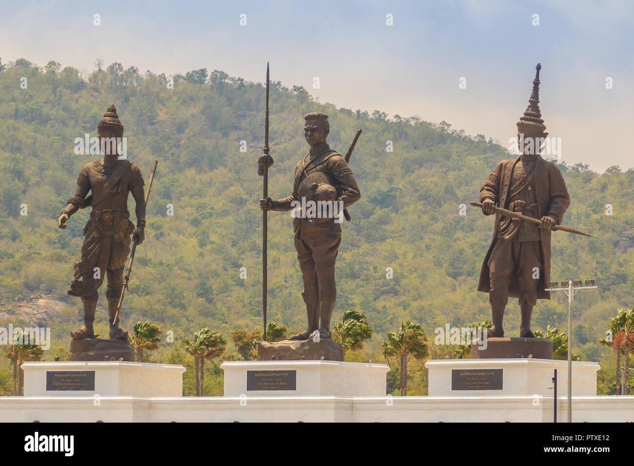 Prachuap Khiri Khan, Thailand - March 16, 2017: The bronze statues three of seven Thai kings in the mountain and blue sky background at Rajabhakti Par Stock Photo