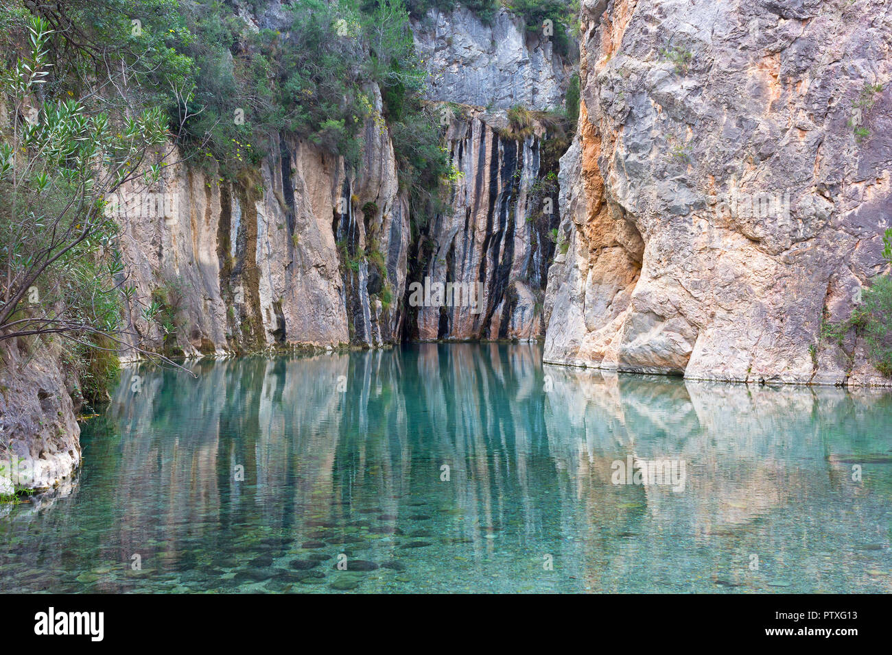 hot springs in a beautiful mountainous canyon in Valencia region of Spain. Landscape of clear water with reflection surrounding mountains Stock Photo - Alamy