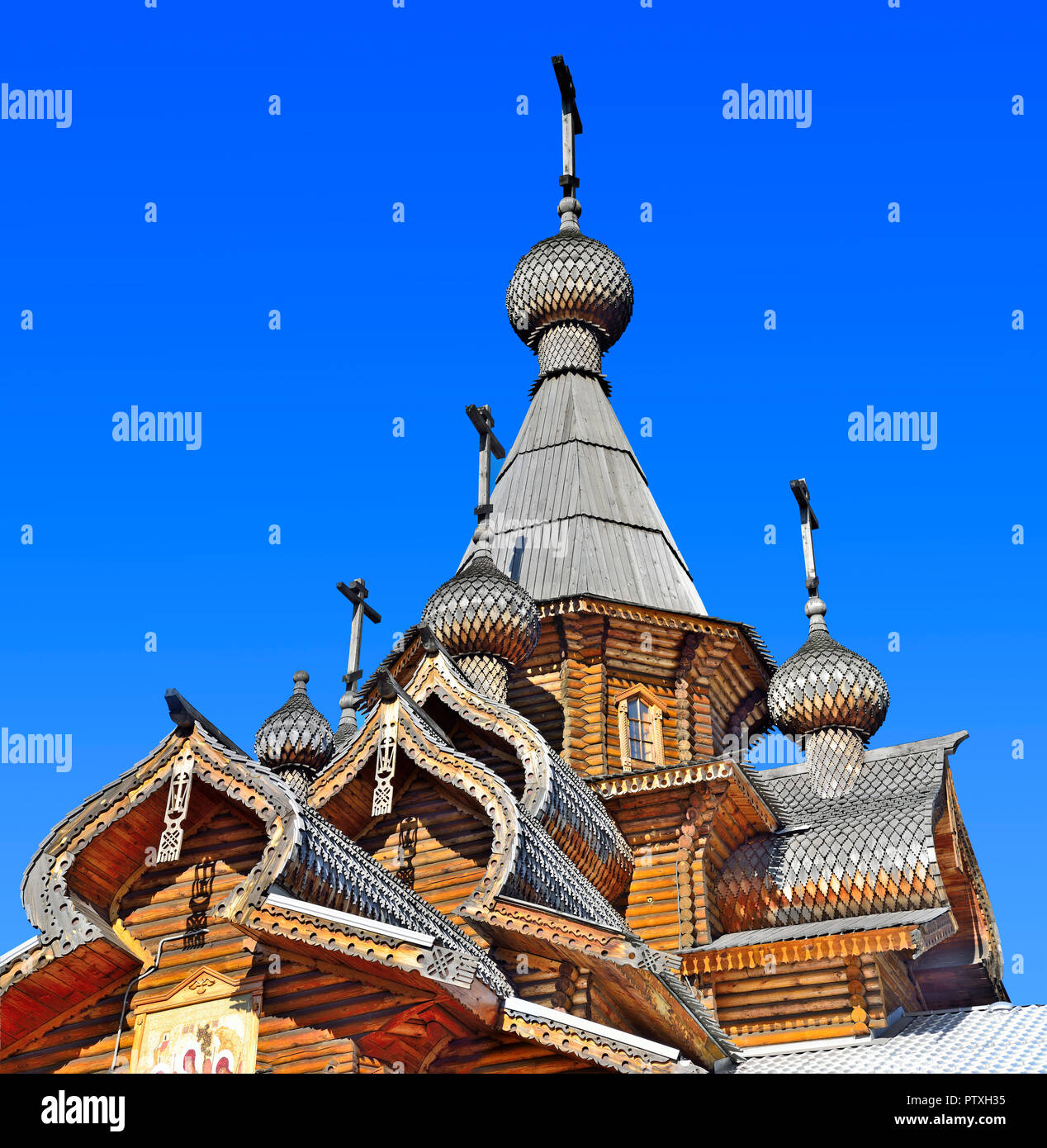 Christian Temple of the Holy Martyr John the Warrior in Novokuznetsk, Russia. Vintage traditional technologies for the construction of wooden roofs an Stock Photo