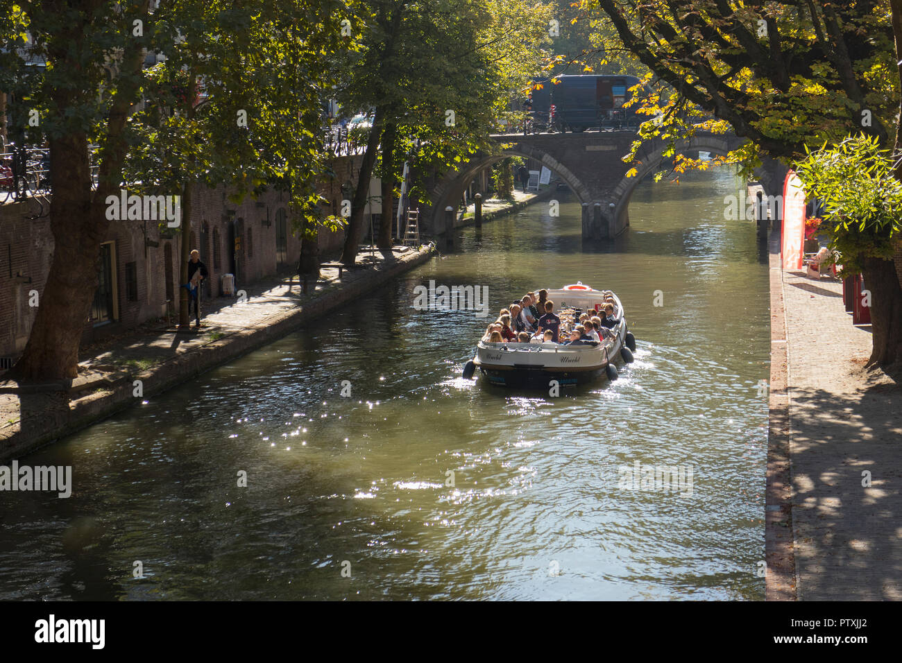 Utrecht, Netherlands - September 27, 2018:  Sightseeing boat in the canal in the historical center of Utrecht in autumn Stock Photo