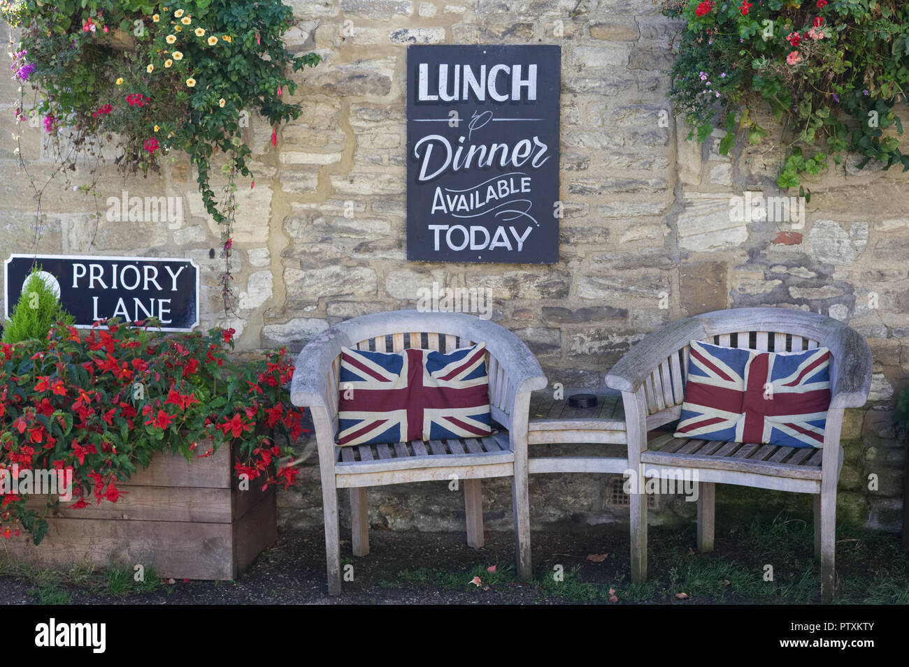 Union jack cushions on wooden outdoor seating Stock Photo Alamy
