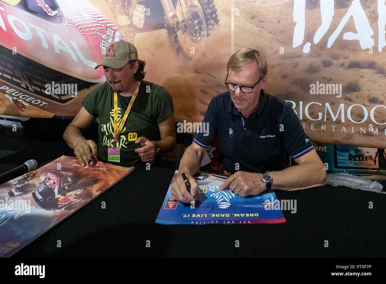 Alges, PORTUGAL: Ari Vatanen testing the portuguese game Dakar18 with Paulo Gomes CEO and Director of Bigmoon Entertainment on 4th and last day of Comic Con Portugal 2018 in Passeio Maritimo de Alges in Alges, Sunday, Sep. 9, 2018. Due to be released on Sep. 11 on PlayStation 4, Xbox One, Microsoft Windows  Featuring: Ari Vatanen, Paulo Gomes Where: Algés, Oeiras, Portugal When: 09 Sep 2018 Credit: Rui M Leal/WENN.com Stock Photo