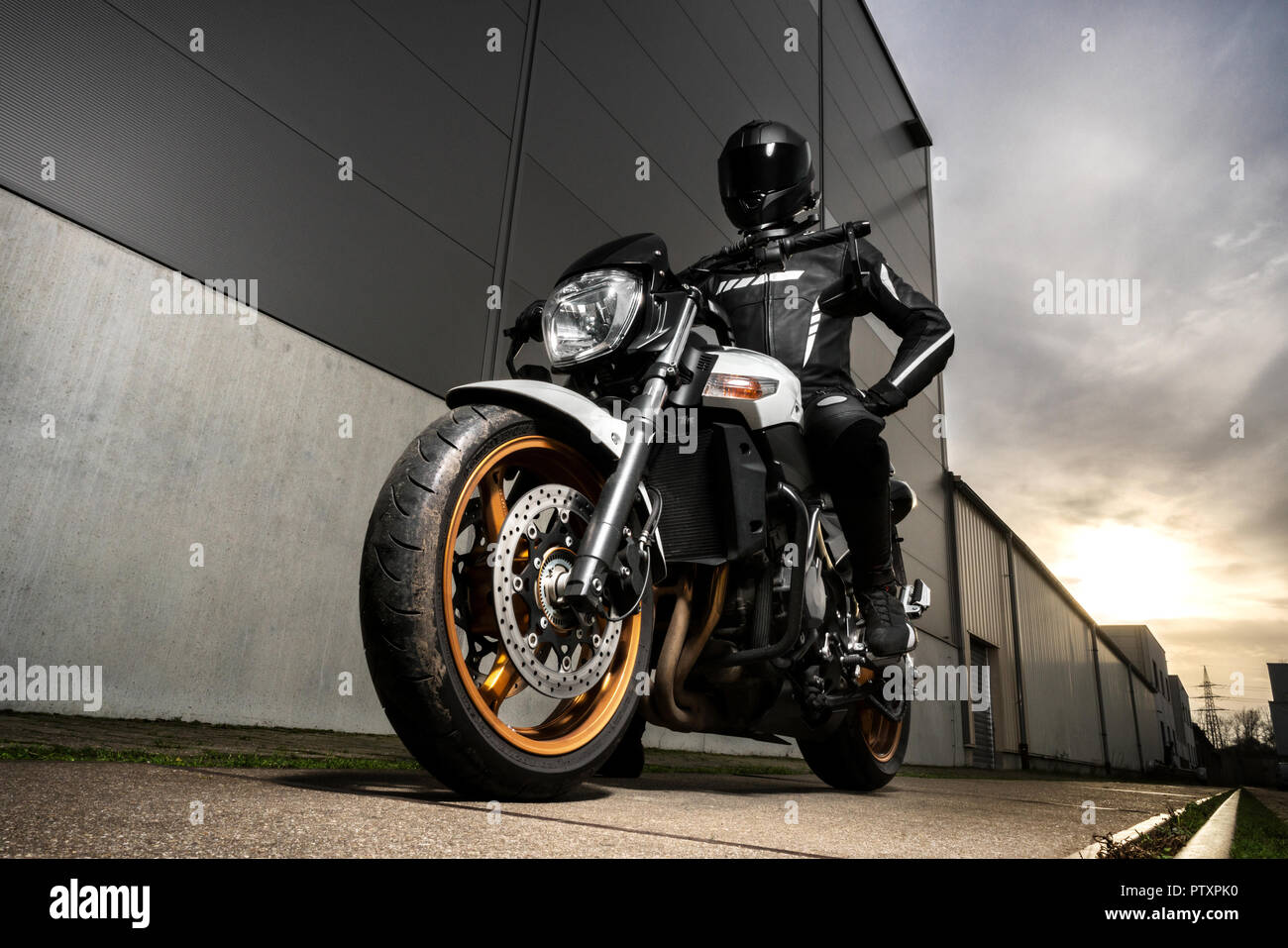 Posing motorcyclist Stock Photo