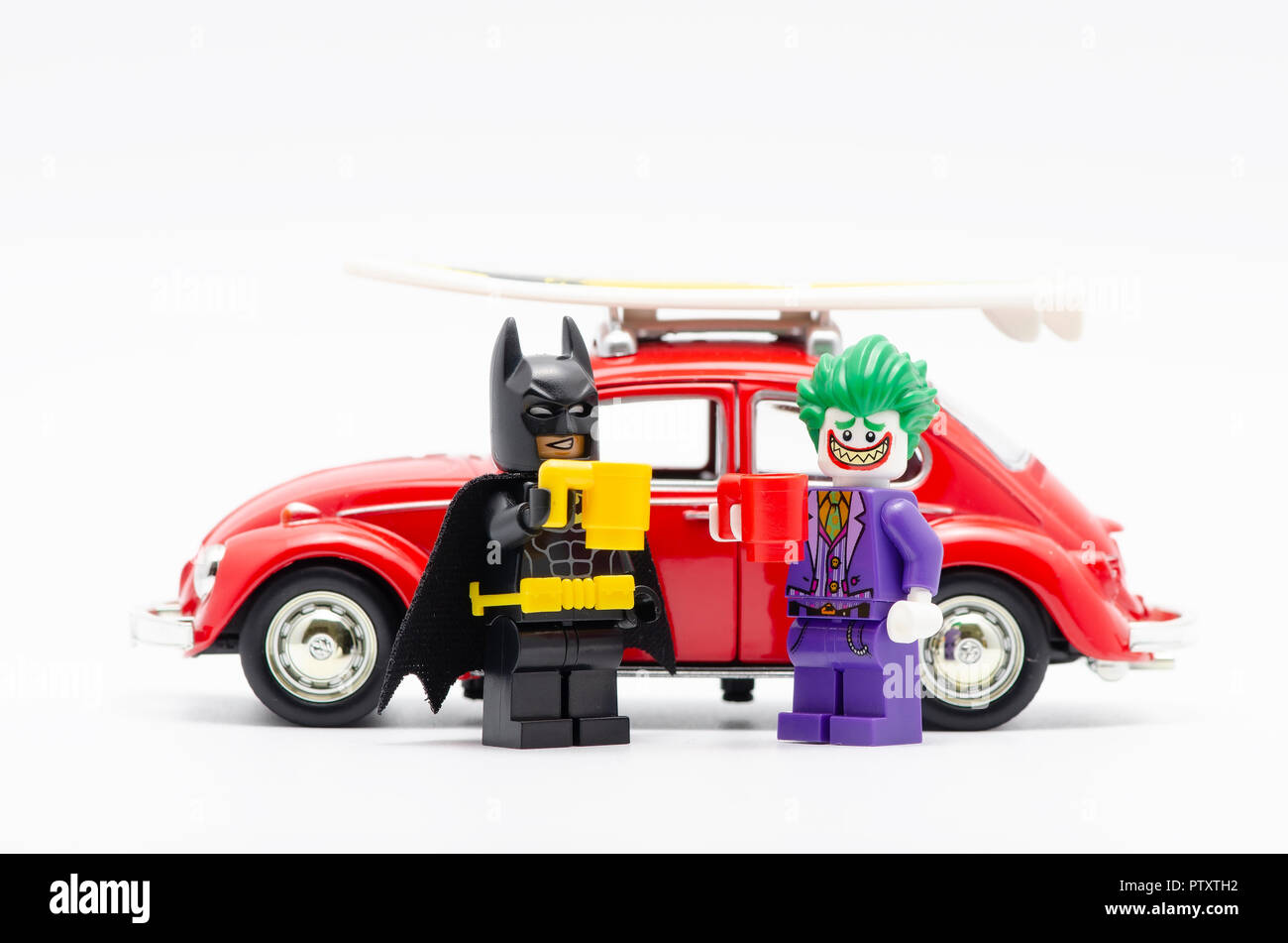 lego batman and joker drinking with volkswagen car behind them Stock Photo  - Alamy