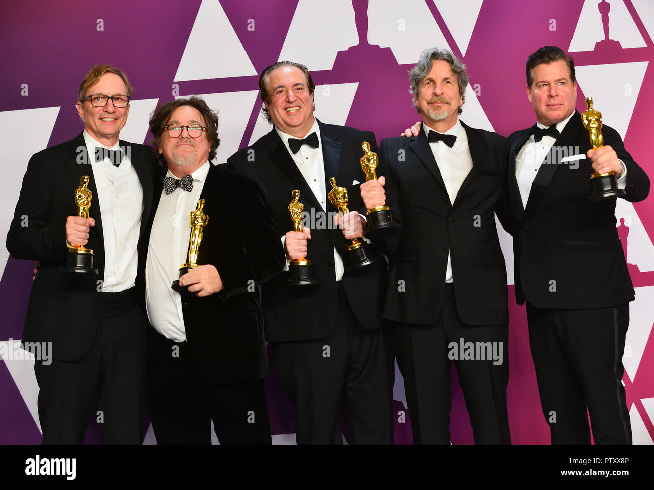 Los Angeles, USA. 24th Feb, 2019. Jm Burke, Charles B. Wessler, Nick Vallelonga, Peter Farrelly and Brian Currie pose with the Best Picture and Best Original Screenplay award for Green Book 040 at the 91st Annual Academy Awards in the press room during at Hollywood and Highland on February 24, 2019 in Hollywood, California Credit: Tsuni/USA/Alamy Live News Stock Photo