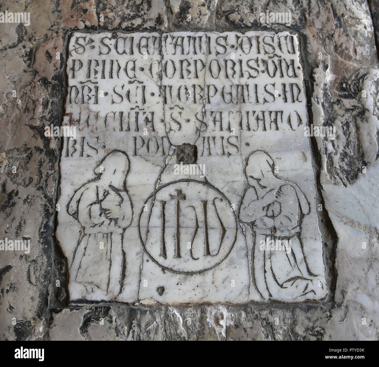 Italy. Pisa. Camposanto. Tombstone. Relief with Gothic script and flagellants. Stock Photo