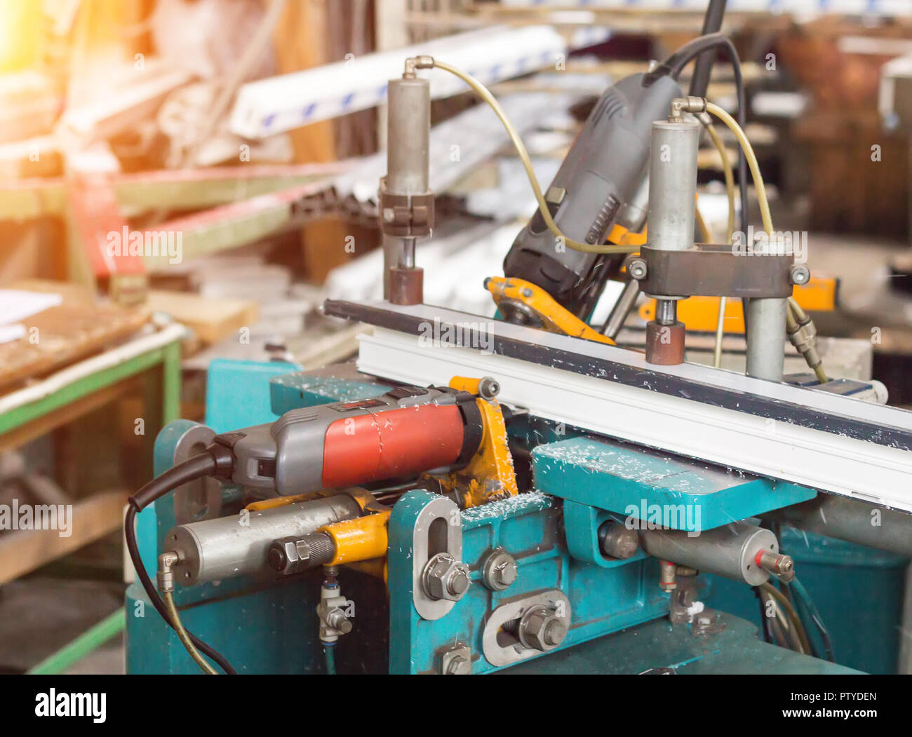 Production of PVC windows, a machine for drilling holes in the frame pvc, drill tool Stock Photo