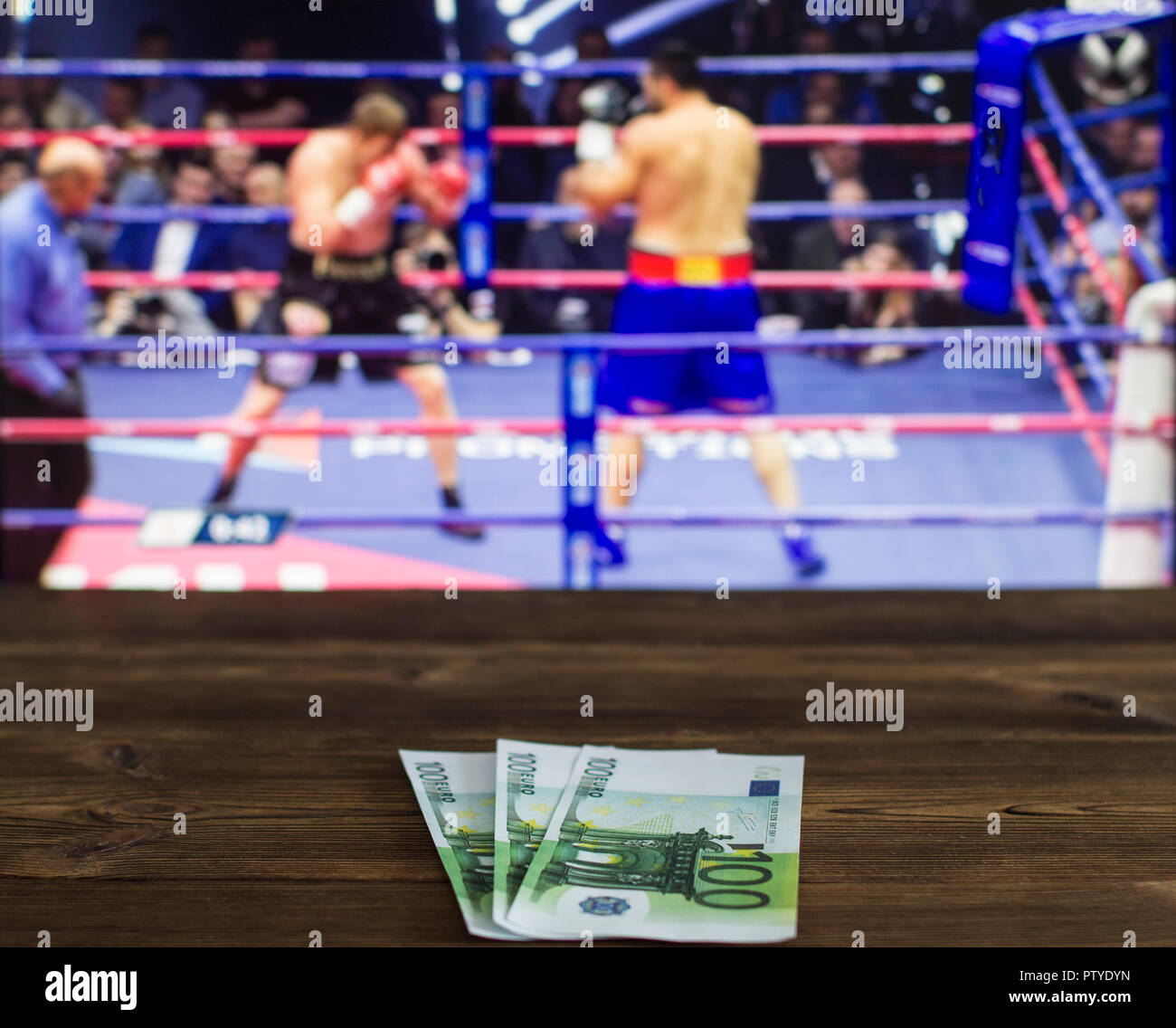 Euro money against the background of the TV on which show boxing, ring  Stock Photo - Alamy