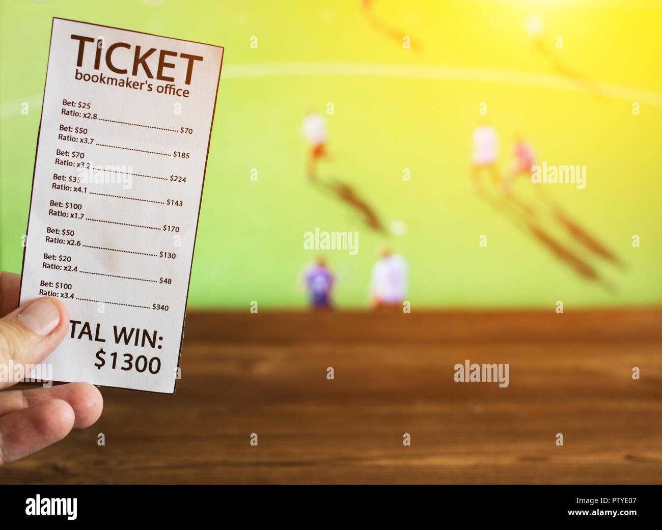 Bookmaker ticket on the background of the TV, which shows hockey on the grass, sports betting, bookmaker ticket, lawn hockey Stock Photo