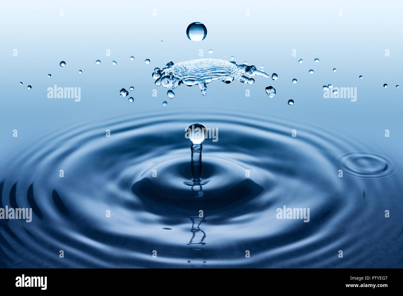 Water splatter and splash. Collision effect of two falling rain drops. Stock Photo