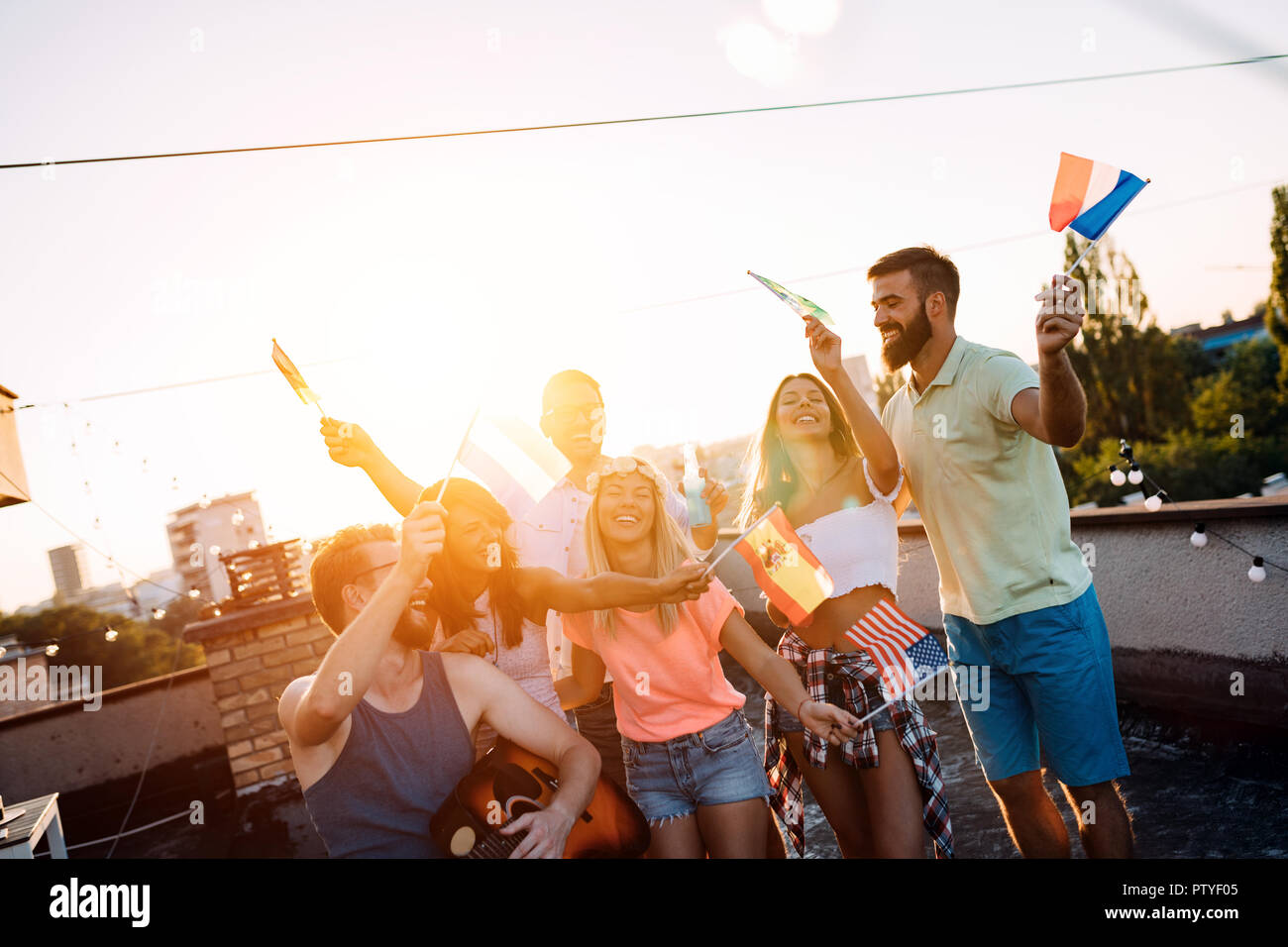 Fun Rooftop Party Young friends enjoying summer rooftop hi-res stock photography and ...