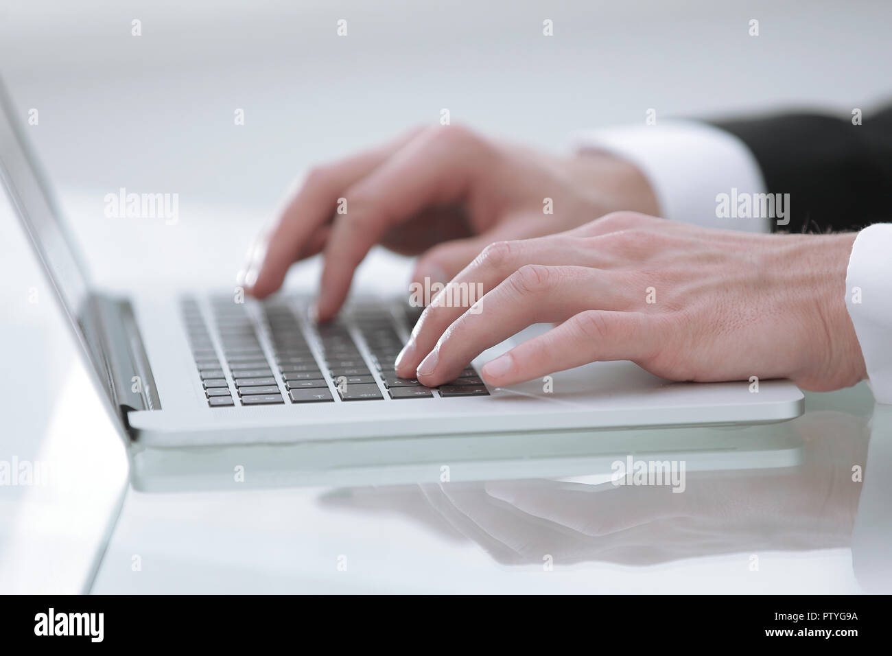 close up hands multitasking man using laptop connecting wifi Stock Photo