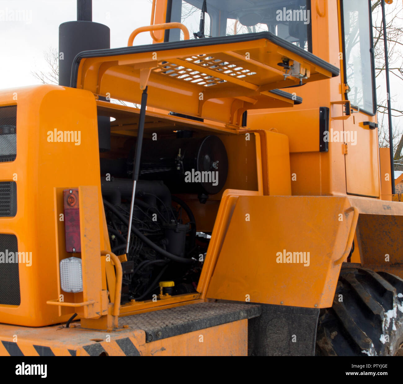 Broken tractor loader, engine compartment Stock Photo Alamy