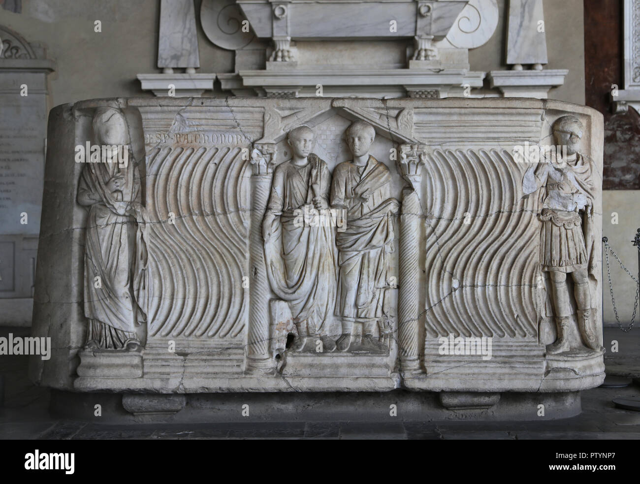 Roman sarcophagus. Strigilated ornament, portraits of the deceased in an aedicule. 220-250 CE. Camposanto. Pisa. Italy. Stock Photo