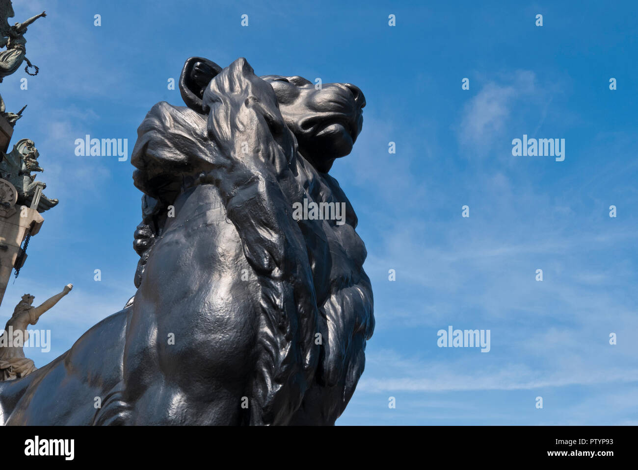 A lion statue as part of the Christopher Columbus monument, Barcelona, Spain Stock Photo