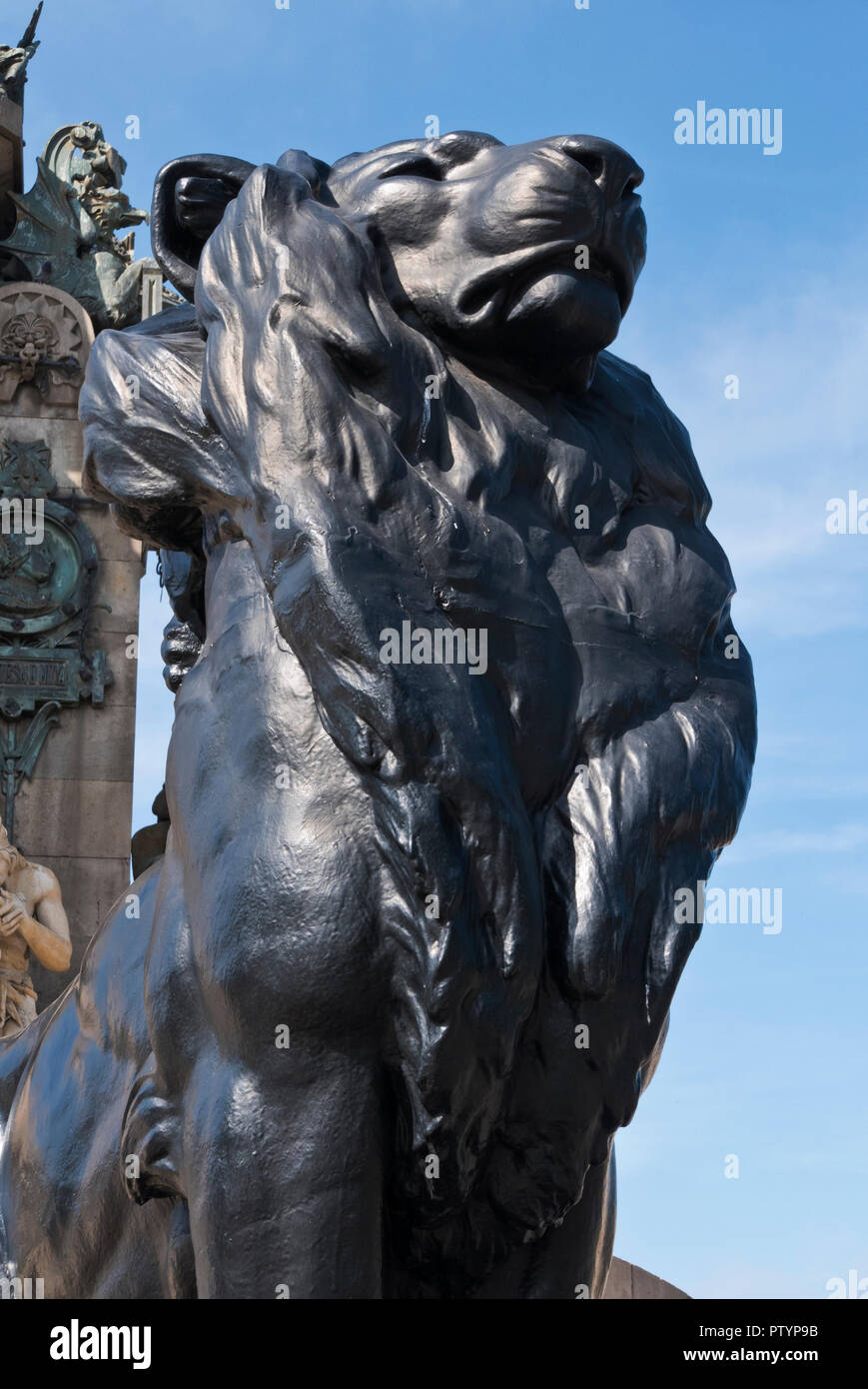 A lion statue as part of the Christopher Columbus monument, Barcelona, Spain Stock Photo