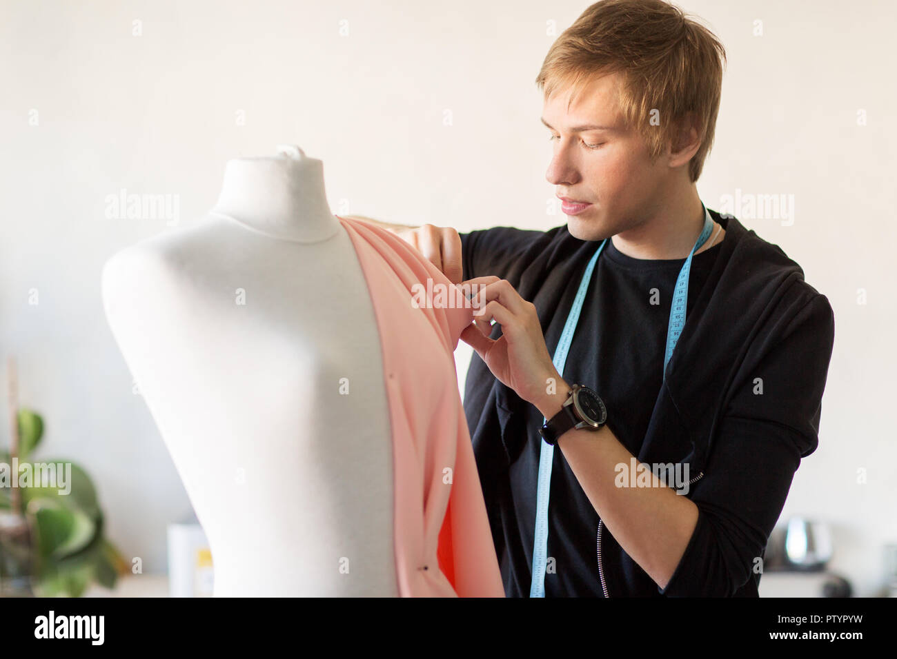 fashion designer with dummy making dress at studio Stock Photo Alamy