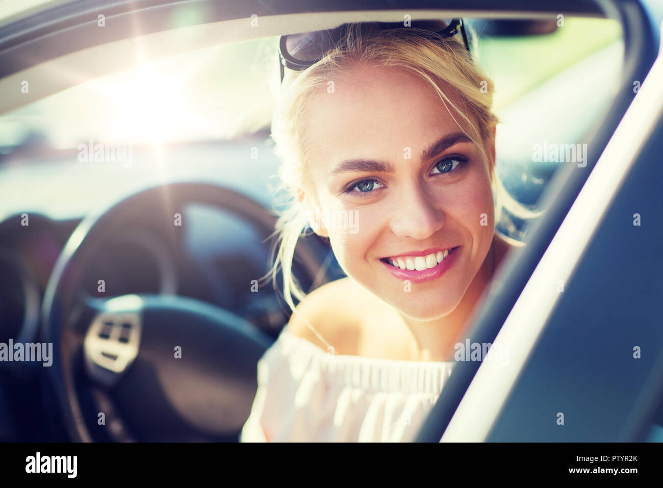 happy teenage girl or young woman in car Stock Photo - Alamy