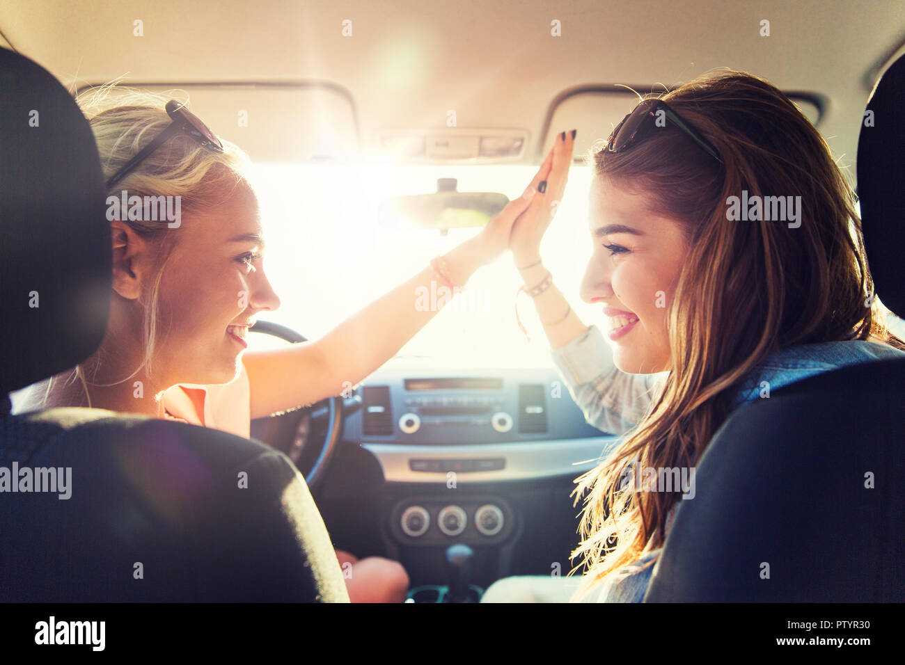 Teenage girls driving car hires stock photography and images Alamy