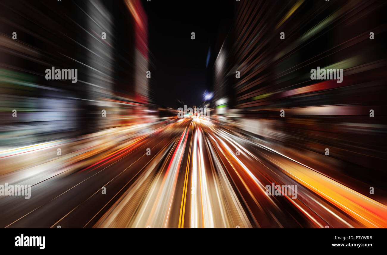 Modern cityscape at night with traffic lights on the street. Blurred background photo Stock Photo