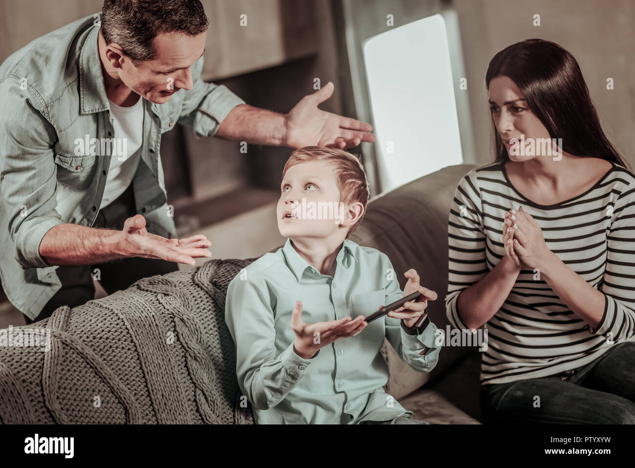 Son and father and tension hi-res stock photography and images - Alamy
