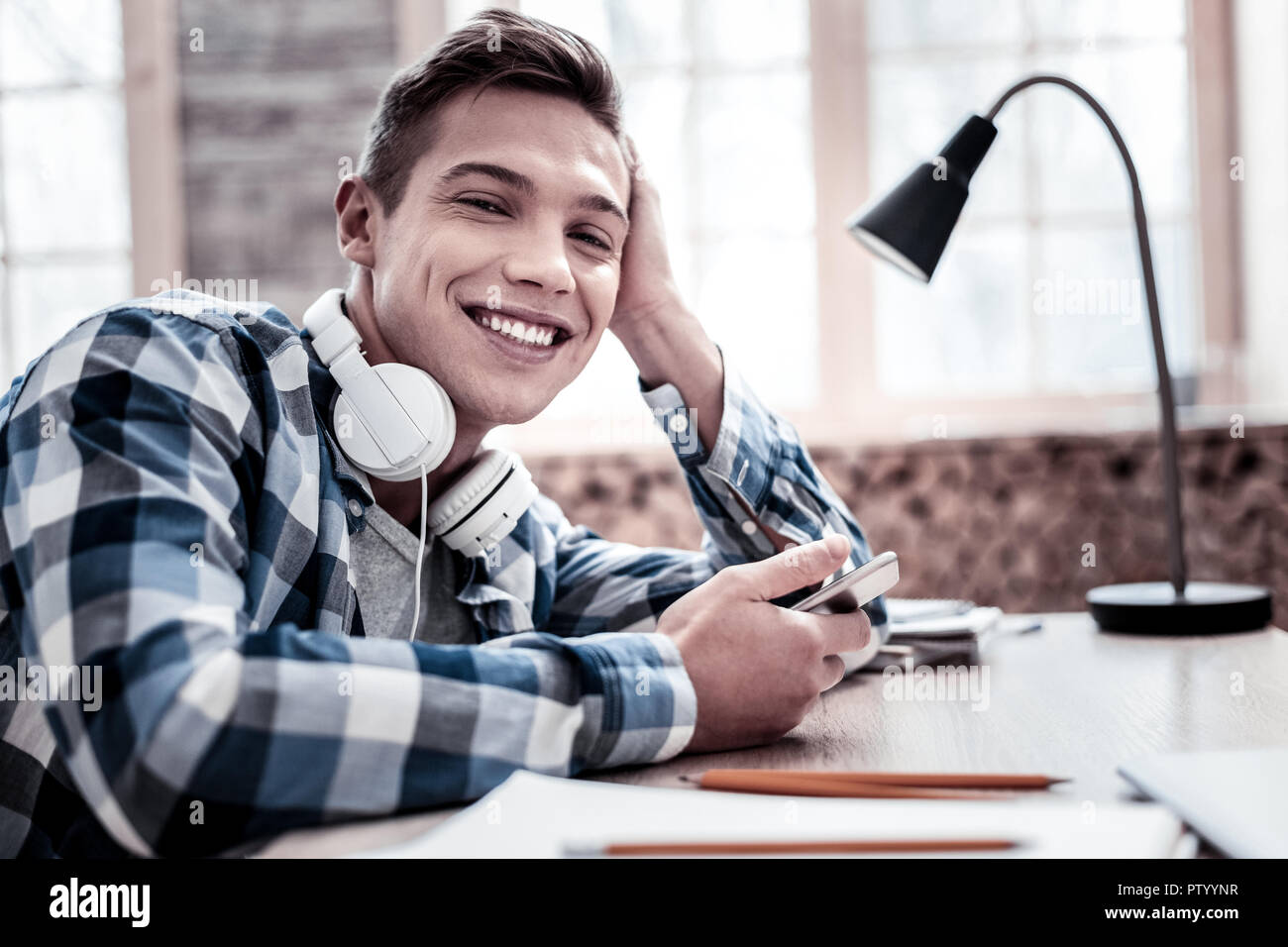 Happy person having nice day while relaxing with music Stock Photo - Alamy